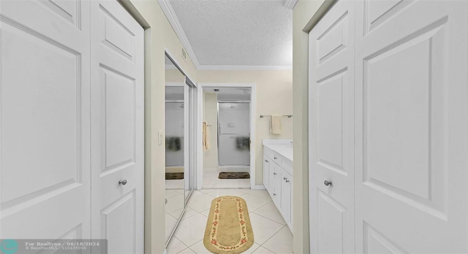 Has three closets, one is a large walk-in behind the sliding mirrored doors.