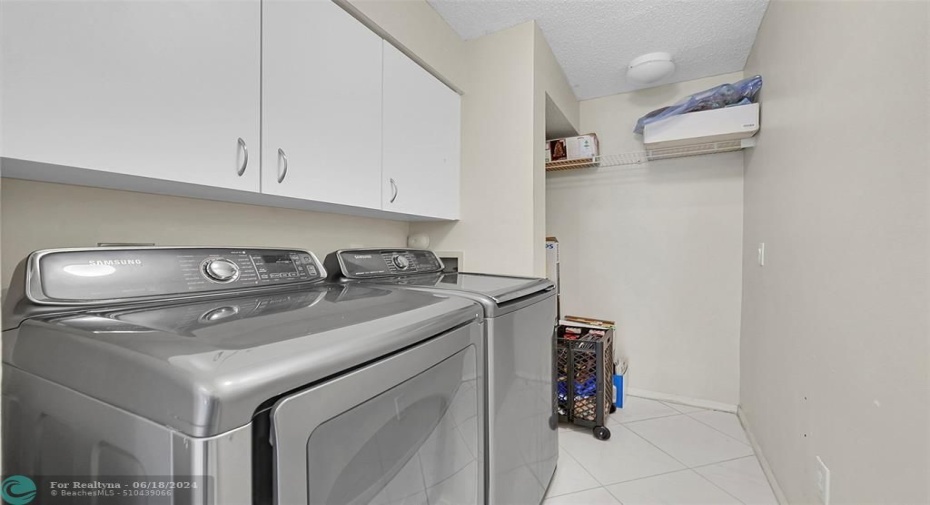 Laundry room with extra storage, water heater