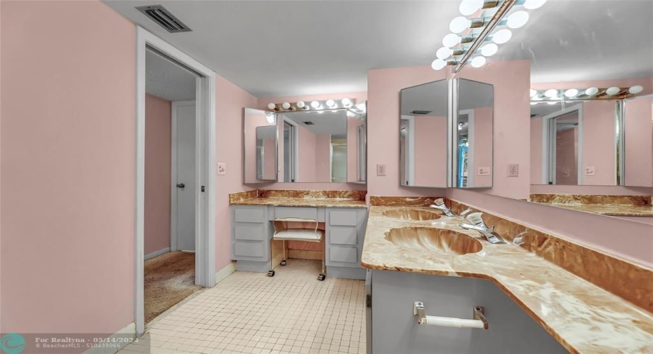 Bright Dressing area and Double sinks in Owner's Bath with walk in shower