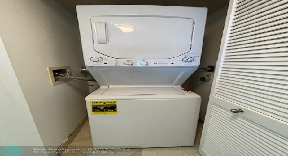The new washer and dryer were purchased the first week of May 2024. They are located at the entrance to the kitchen.