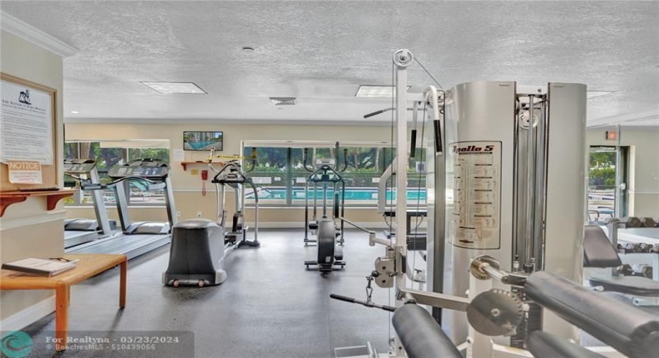 Motivation! The gym faces the large heated pool.
