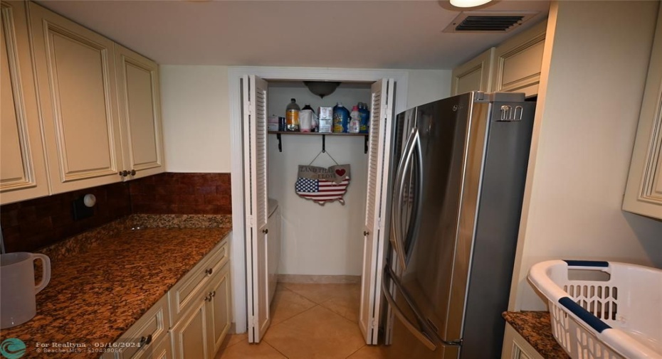 Kitchen showing included Laundry Room