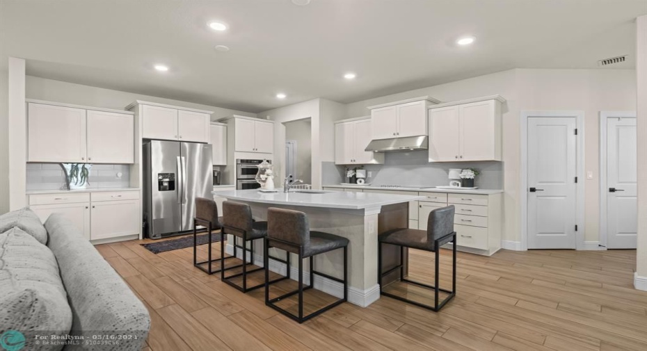 The open floor plan keeps the cook connected to everyone else.