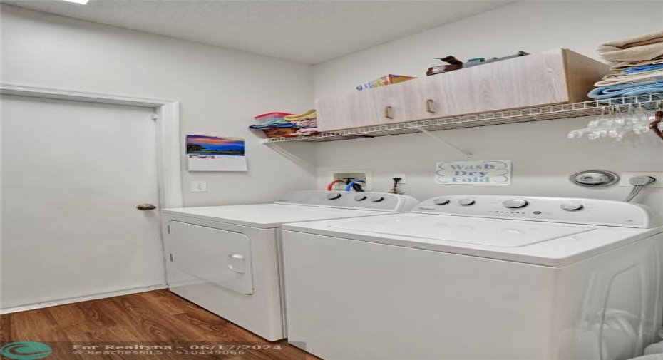 *SEPARATE LAUNDRY ROOM W/SINK AND EXTRA STORAGE SPACE.*