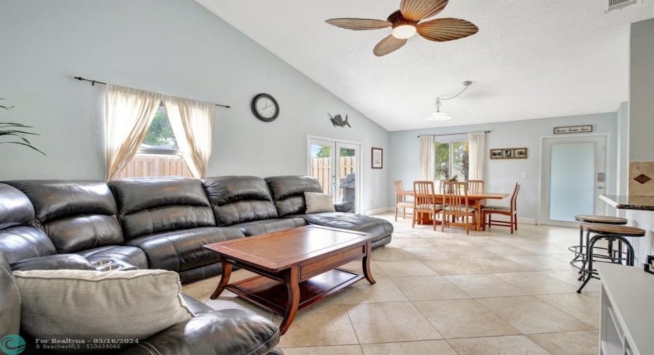 This lovingly maintained home offers a practical floor plan with spacious bedrooms, a large Family Room (converted from the Garage) and  an abundance of natural light from the high impact windows and a vaulted ceiling in the seamless living /dining room area.