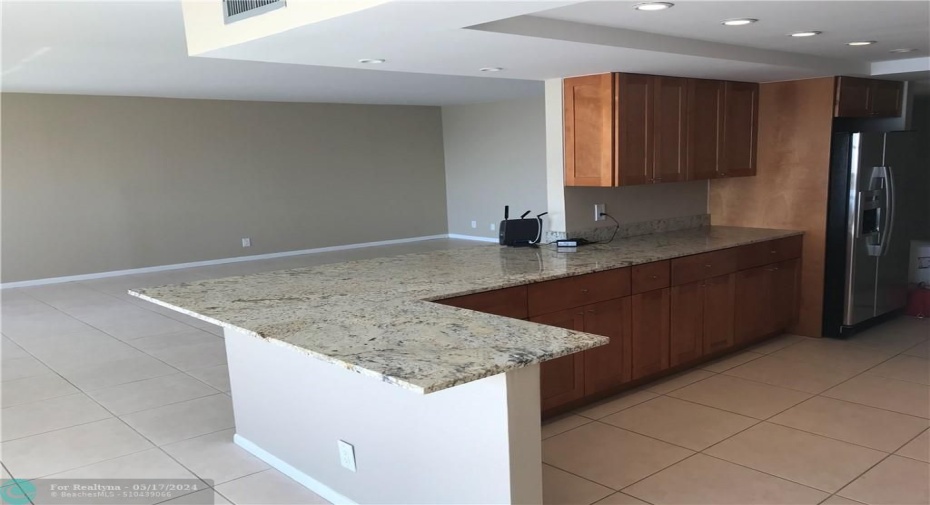 Open renovated kitchen. Granite with new cabinets.