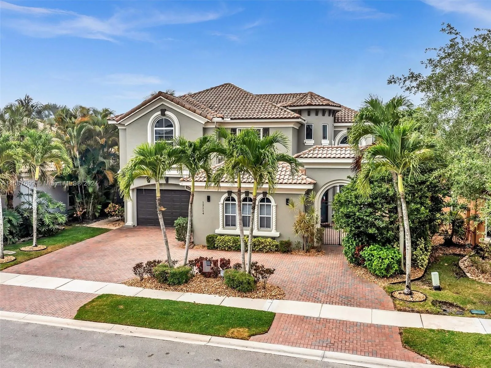 Amazing curb appeal with circular driveway and lush landscaping!