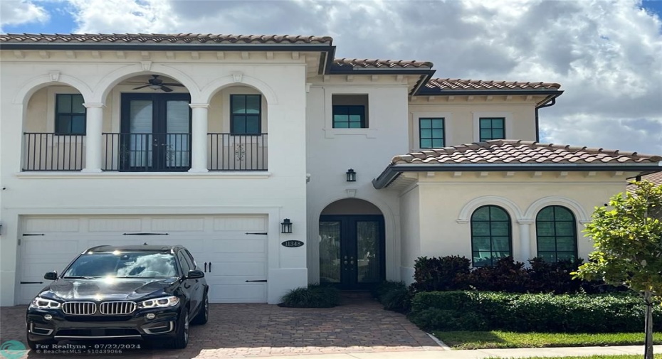 Front of the house with 2 car garage.