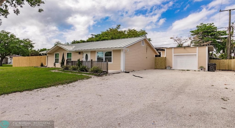 Front of Garage with Open Parking spaces