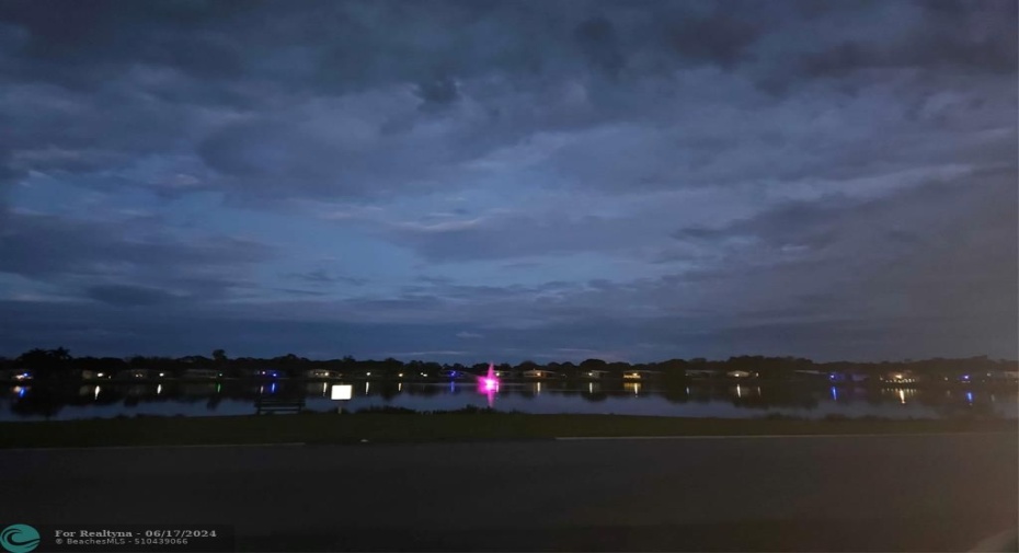 Lit up Fountain in Community Lake