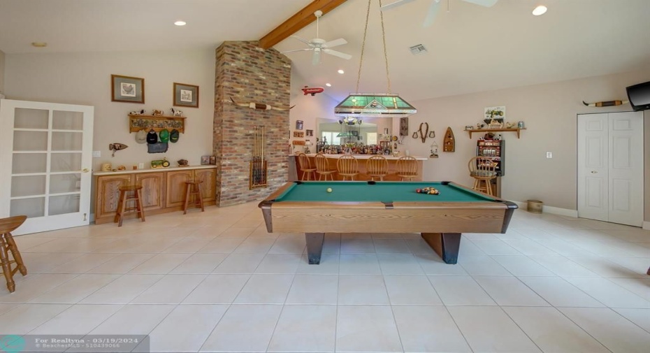Tons of room for all your games! Vaulted ceilings and access to the patio!