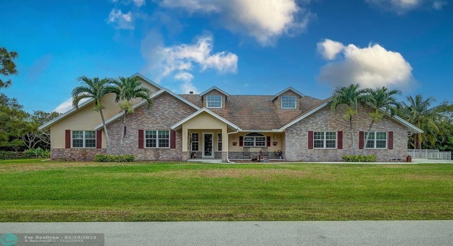 Gorgeous elevation with covered front porch situated on one acre