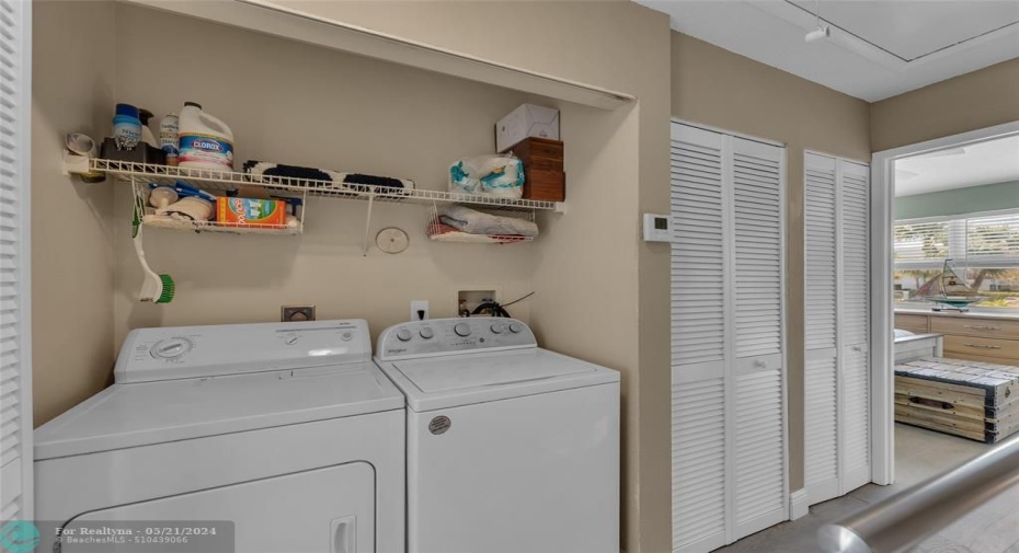 Washer and dryer located upstairs with extra storage