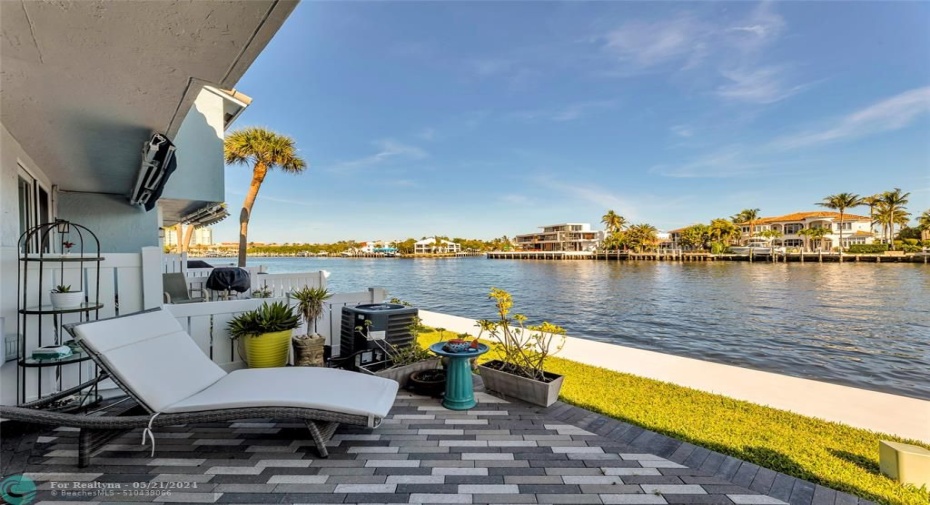 Pavered back patio is the perfect retreat for boat watching
