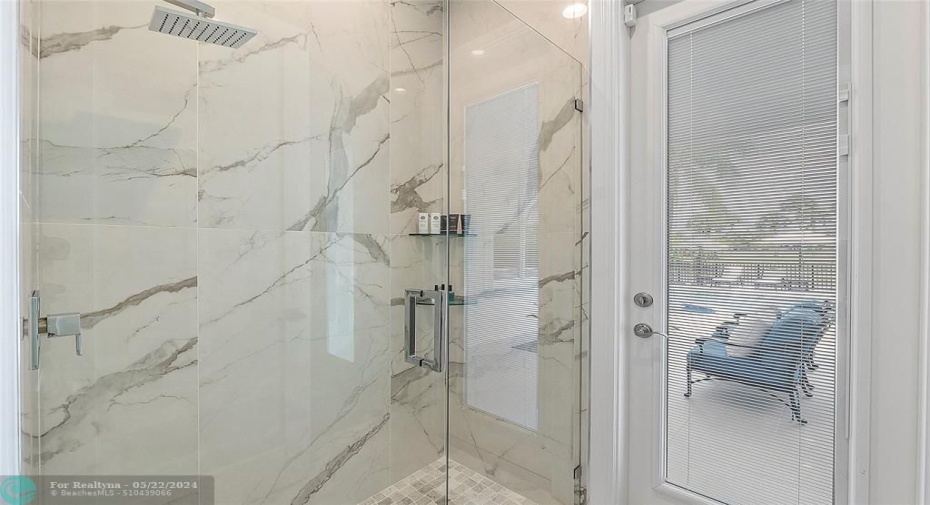 Cabana bathroom shower is floor to ceiling porcelain with modern stainless hardware