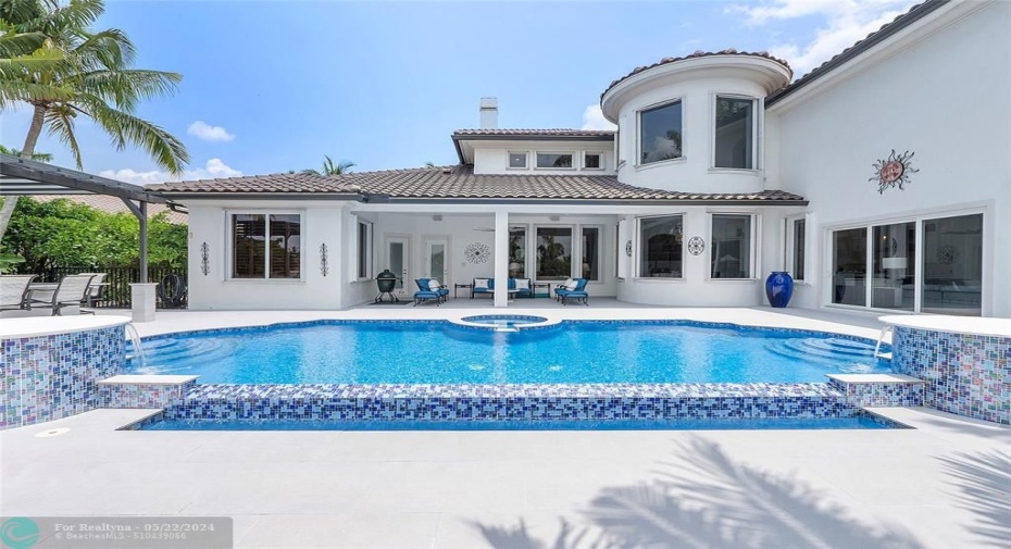 Sapphire blue and white Masterpiece Pool & Patio with castle tower