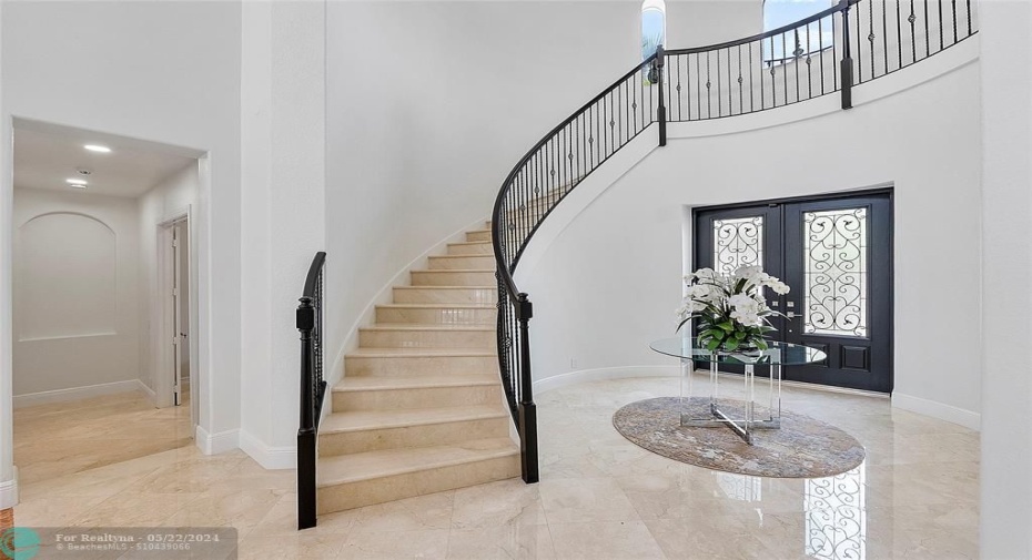Lets go up the perfect  marble circular staircase with real oak & wrought iron banister
