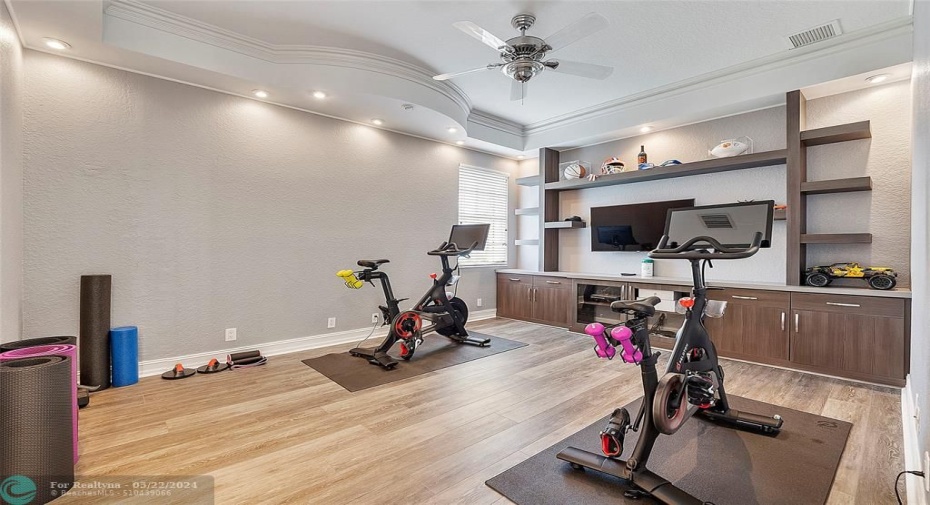 Fitness room or gamers room  with built -ins and LED lighting, Could be a 6th bedroom if needed as it has an adjoining bathroom