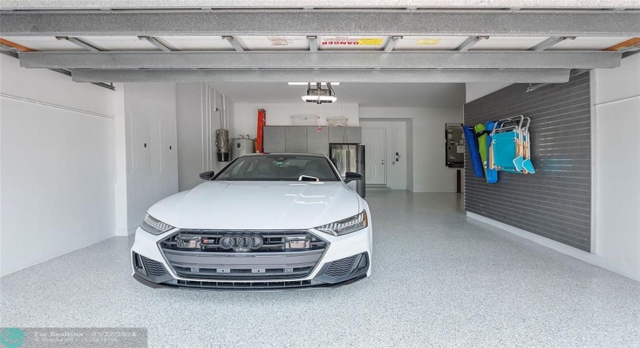 Plenty of room for 3 cars in the 3 car garage and then you have your circular driveway also, Hurricane impact Garage doors, Wall slats for shelving installed by 