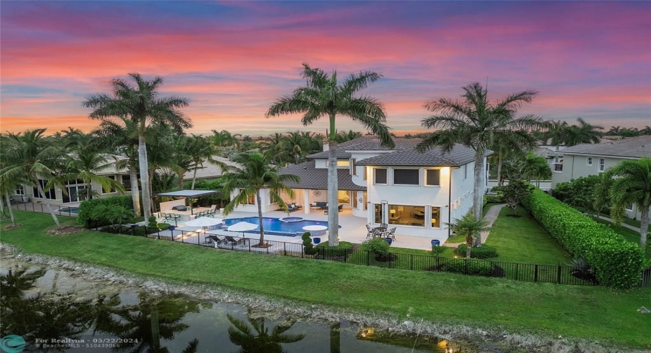 Perfection framed by 4 Royal Palm Trees, This home has 3 newer A/C units,All the features are controlled by your smart phone APP. Spillover infinity waterfall, Pentair automation controls the spa & waterfalls & pool heater