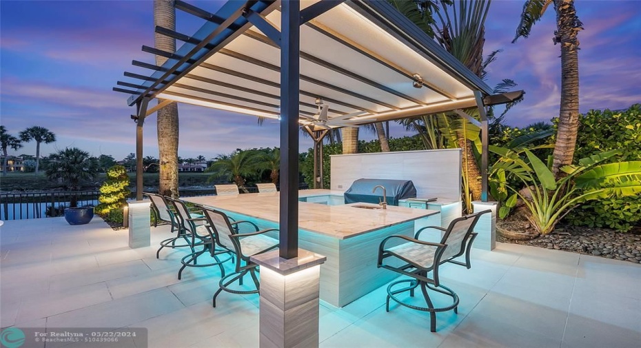 Spectacular Pergola bar and Grill with summer Kitchen, Impress your friends and neighbors by inviting them over for sunset Pina Coladas, This underlighting color changing bar is controlled by remote APP
