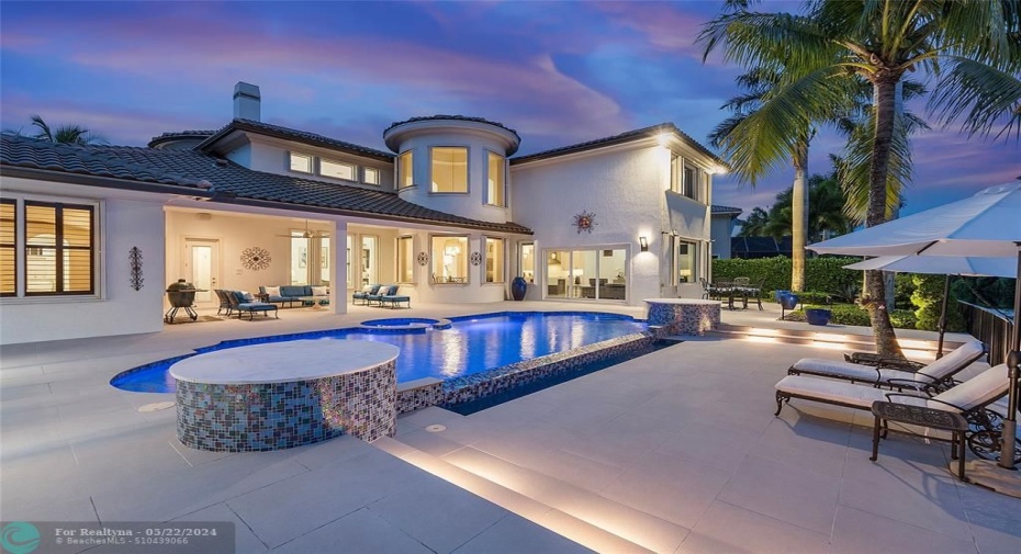 Breathtaking views of this spectacular remodeled patio and heated color changing LED pool with fountains & Spa