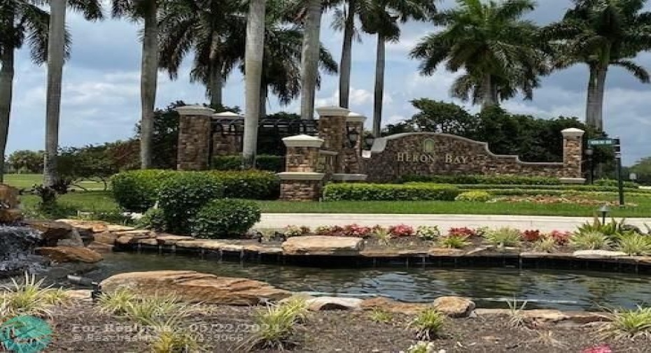 Heron Bay Entry, Heron Bay has 3 guard gate entryways which are strictly manned with security & guards, 24/7 roaming guards around the Country club resort style neighborhood, low low maintenance fees,