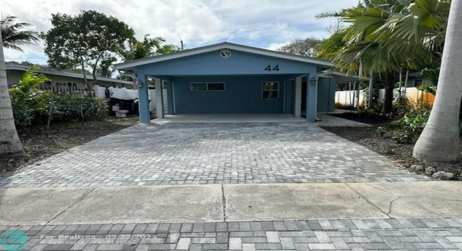 Front of Building with view of Carport and Driveway