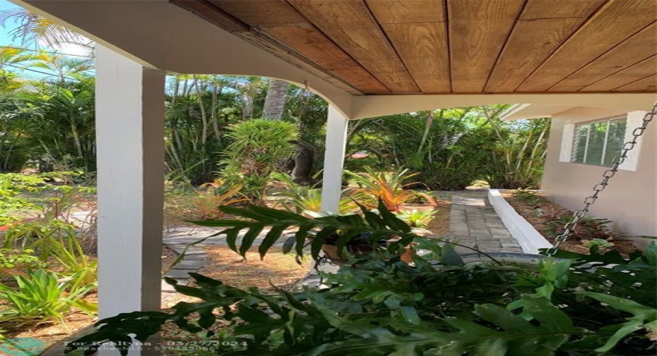 Front Porch with a Beautiful View of the Garden Island of Bromeliads!