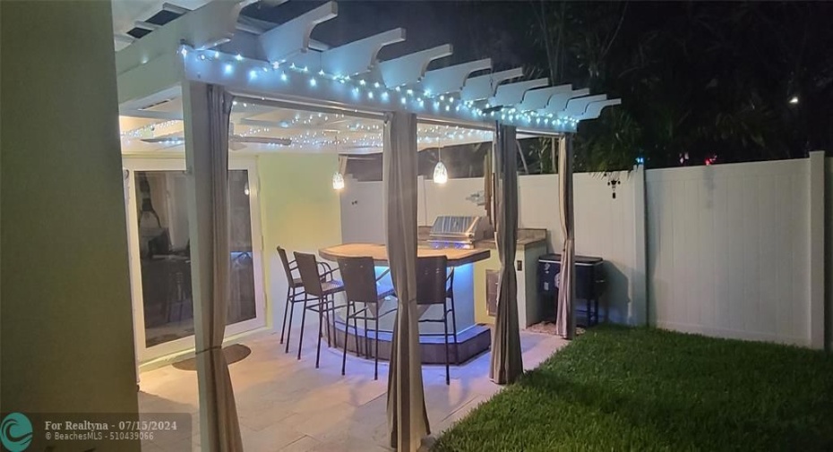Outdoor kitchen night view (includes color changing under counter lighting)