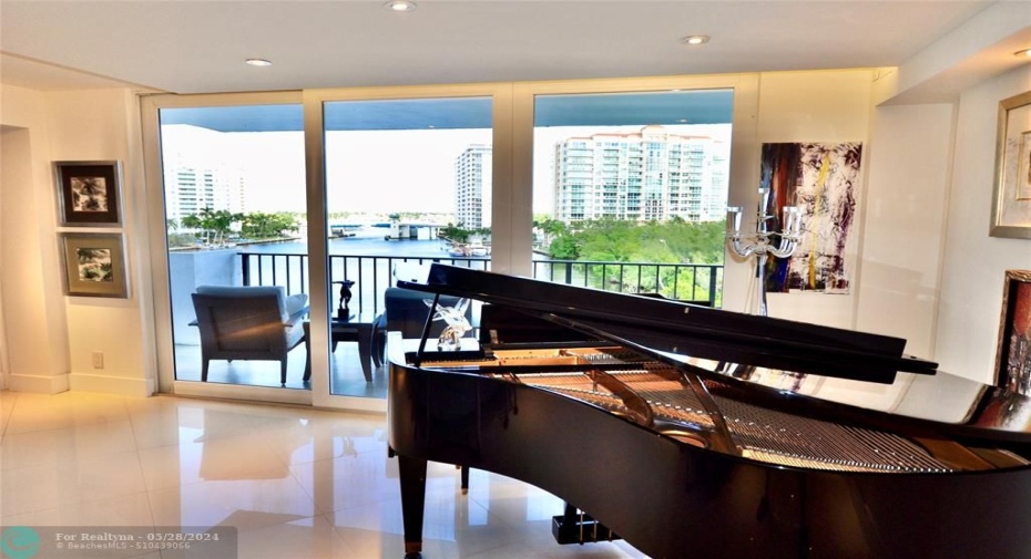 The baby grand piano finishes the living area in style.