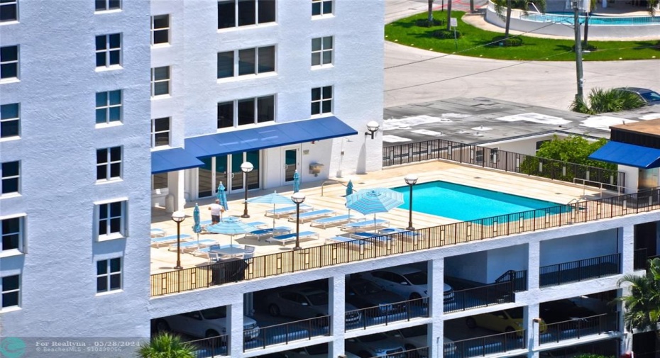 The building's 4th floor accesses the amenities including the pool and sun deck.  Note that unit 601's windows are third row up on the left.