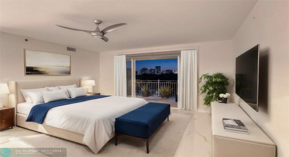 Master Bedroom with a private balcony to enjoy the water and skyline views - Photo is staged
