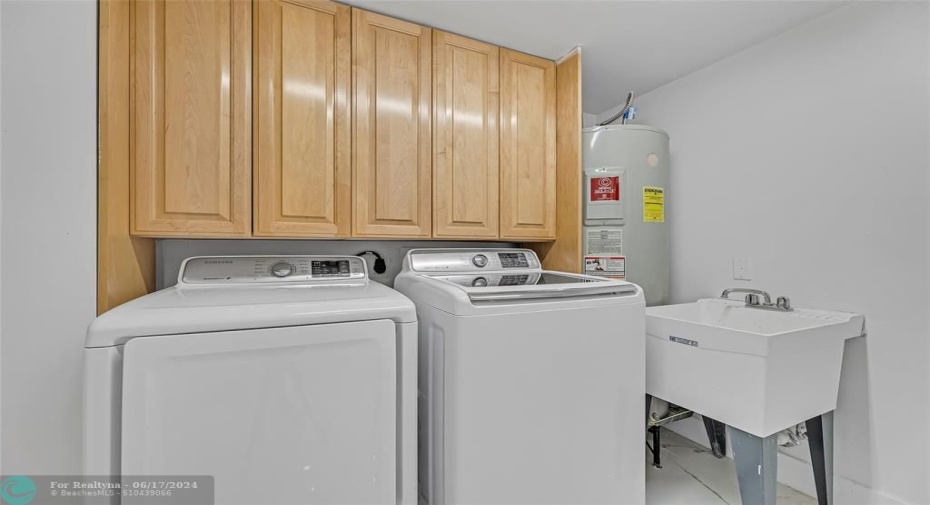 Utility Room with oversized washer and dryer and wash bin with tons of storage