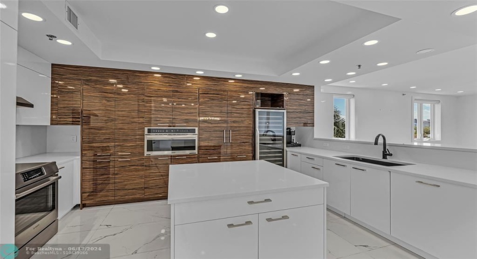 Modern and sleek updated kitchen that is open and spacious to main living area