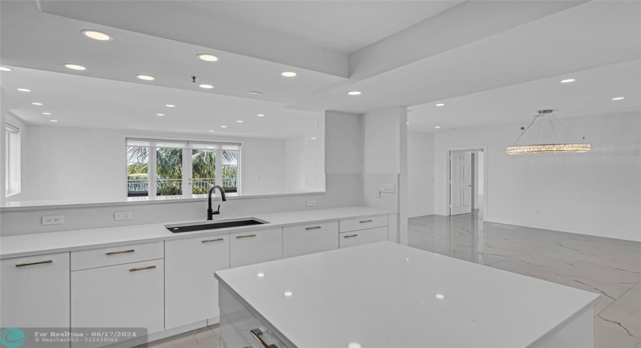 Open and spacious and white and bright kitchen and main living space