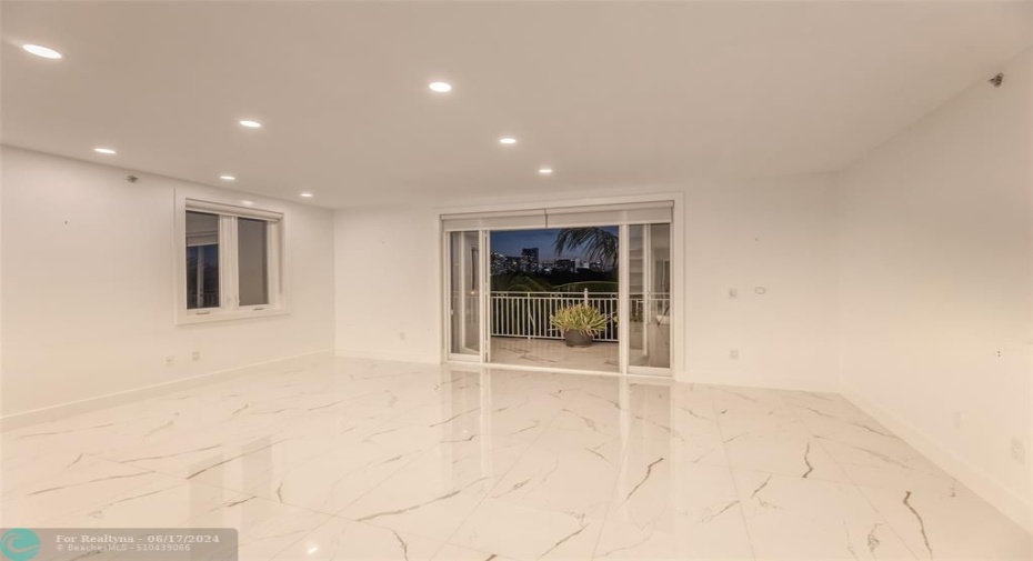 Living room and private patio is the perfect space to enjoy the sunsets and skylines