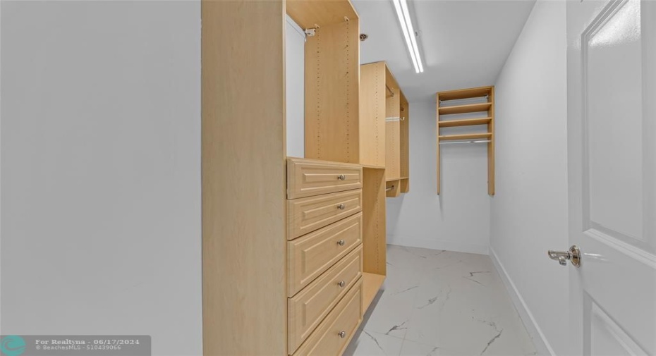 Large walk in custom closet offered in master bedroom