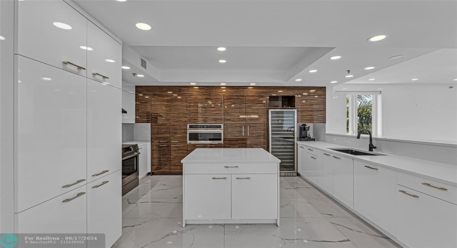 Fully remodeled gourmet kitchen offers high end Bosh appliances and wine fridge