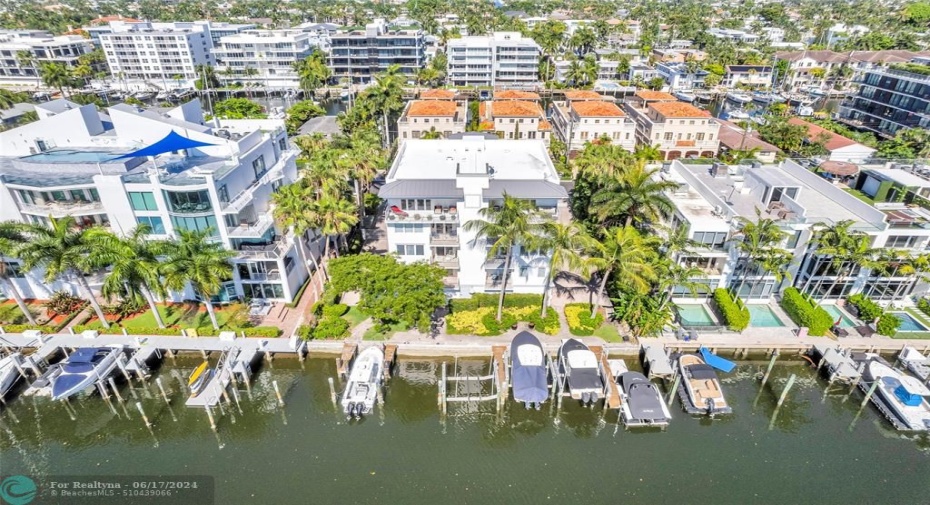 Top floor condo on the water offers huge covered patios and an assigned boat slip and lift