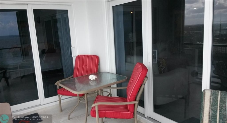 Balcony w/ impact door. Your sitting area facing SE ocean view !