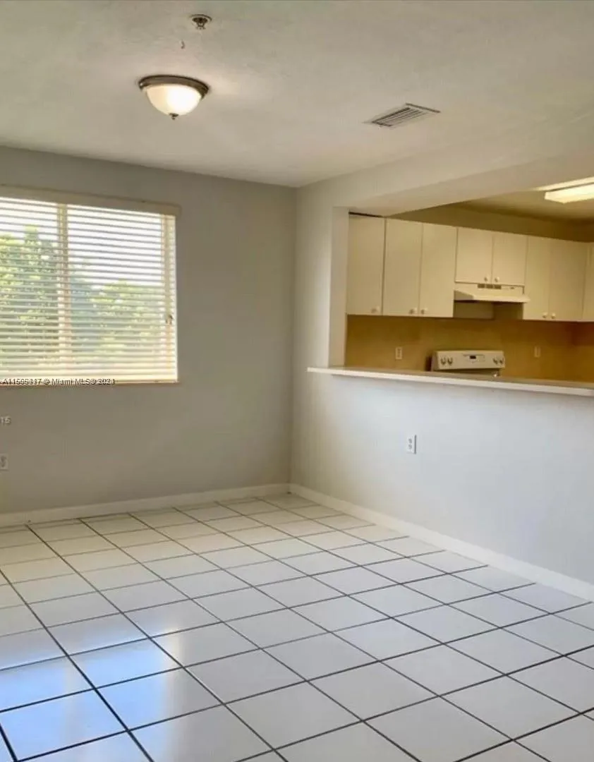 open kitchen w/ serving counter to dinning area. Lots of large windows