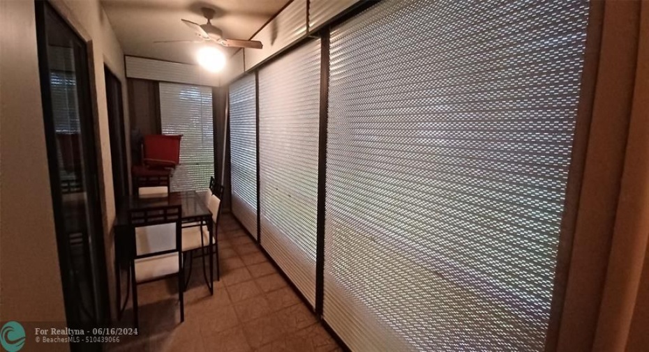 Screened Patio with Roll-up Shutters