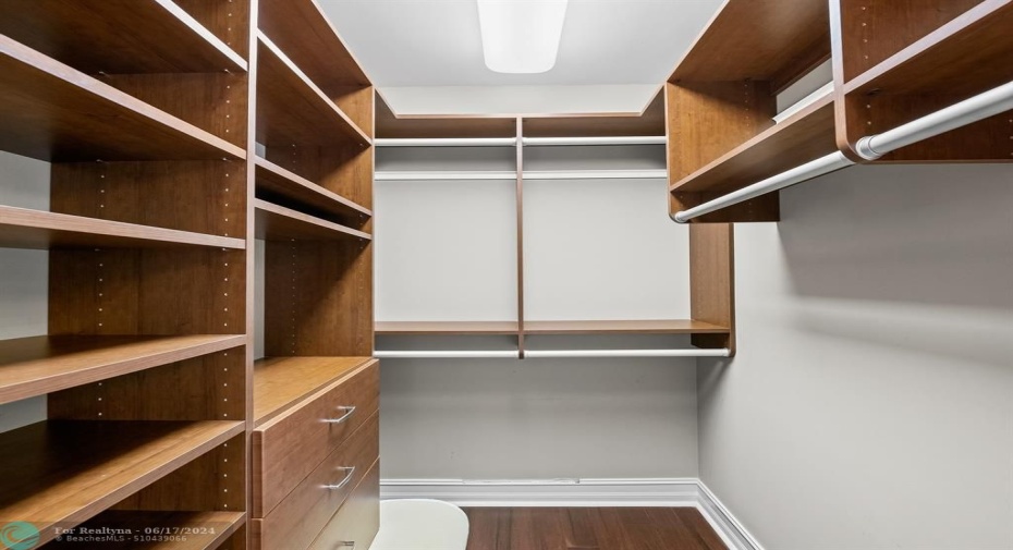 One of two fully customized walk-in closets in the primary suite.