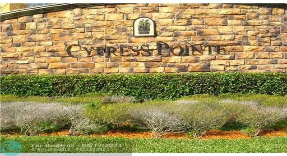 Entryway to Cypress Point is located inside Heron Bay Parkland and you can walk to the clubhouse if desired
