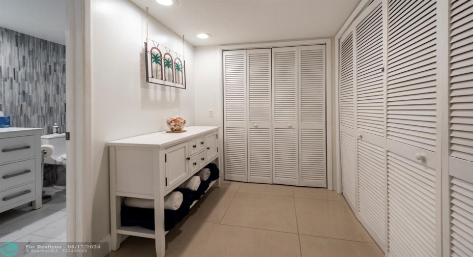 Primary closets leading to bath-