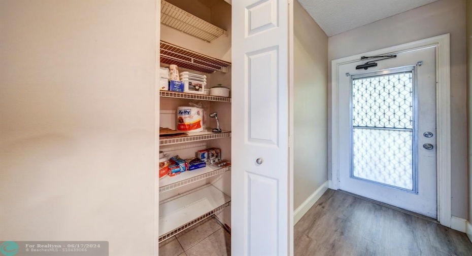 What a practical condo--a nice pantry right near the kitchen!