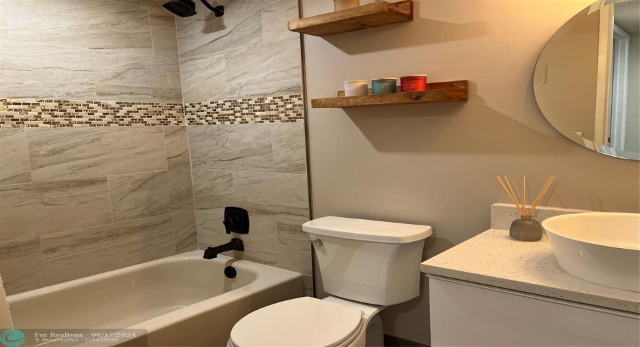 Second bathroom has combination tub/shower