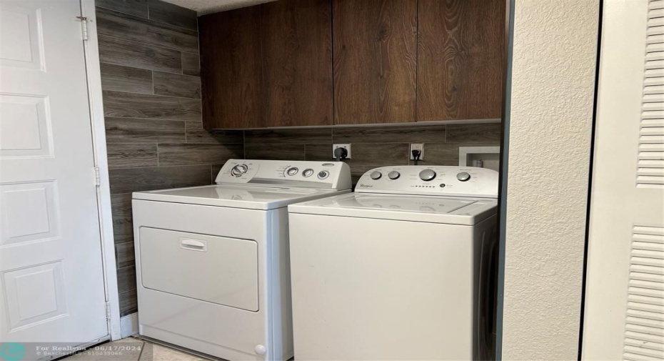 Full size washer & dryer and extra storage cabinets