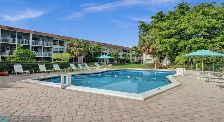 Heated pool with newer lounges and umbrellas